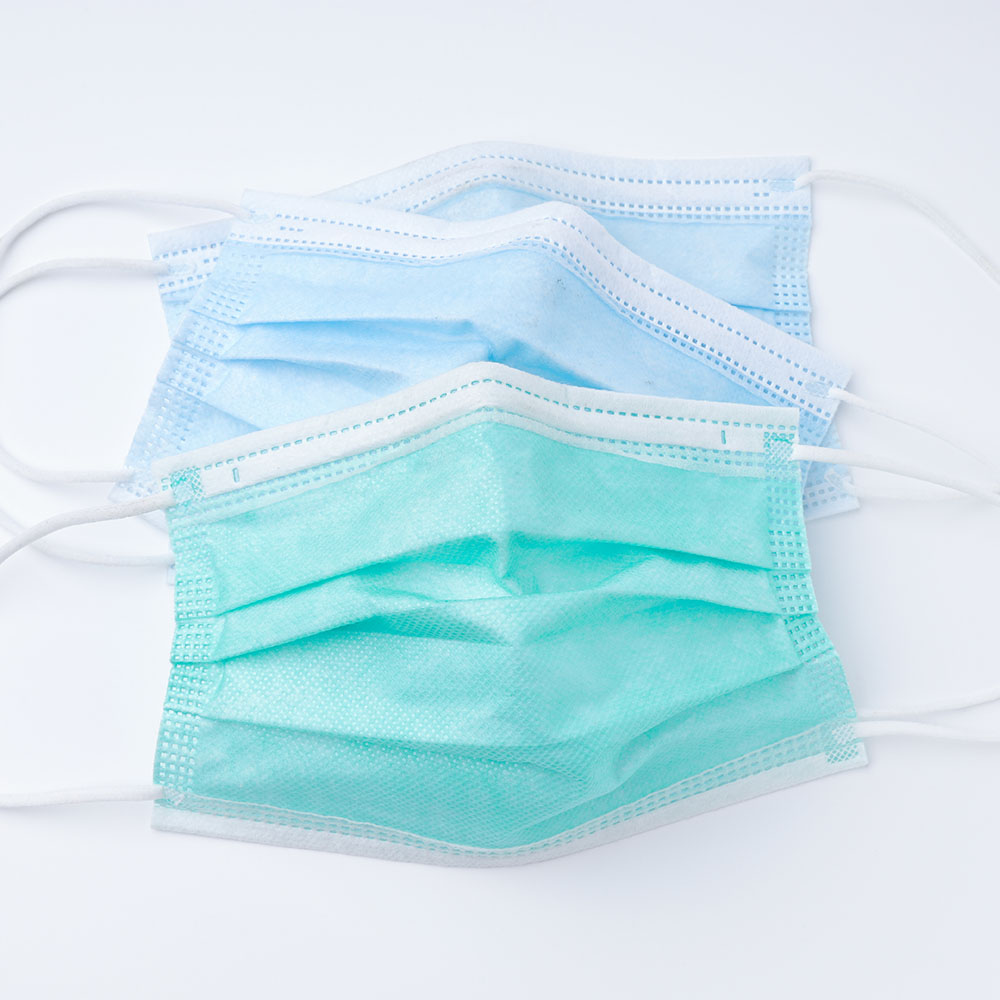 Green and blue disposable surgical face mask